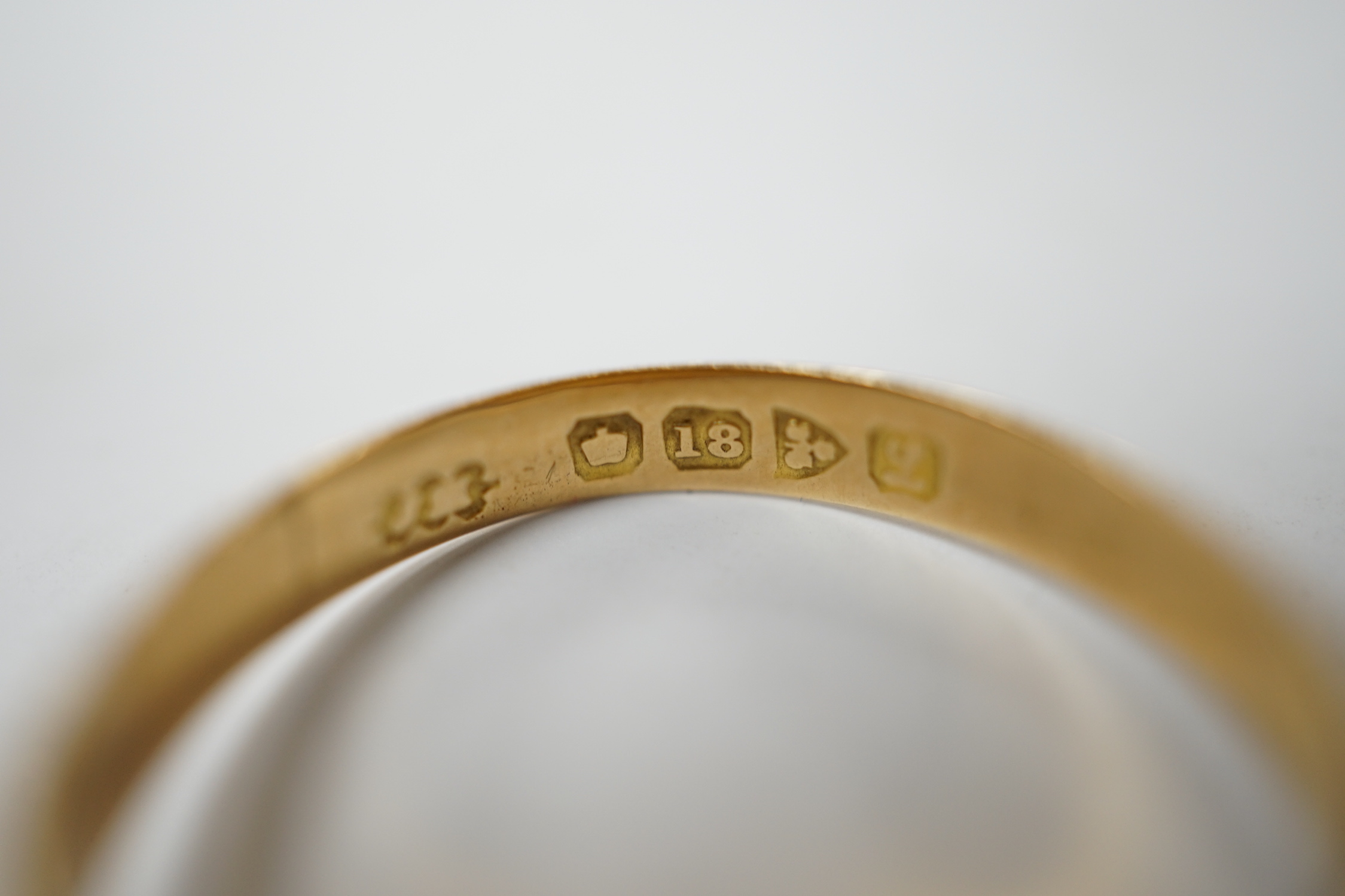 A George V 18ct gold and three stone gypsy set diamond chip set ring, size R, gross weight 3.3 grams.